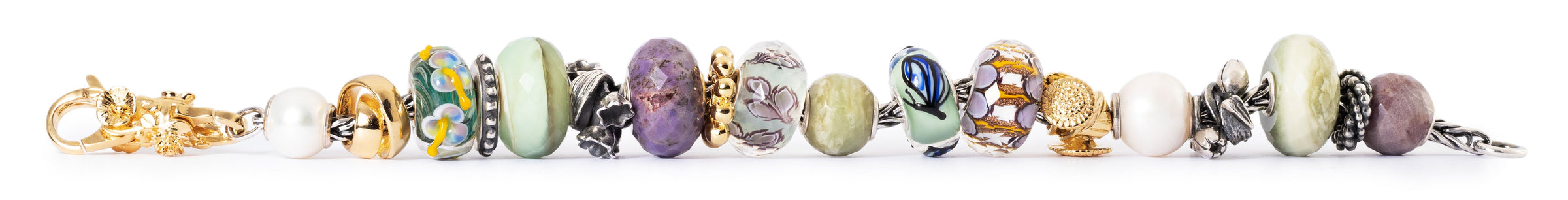 Row of colorful beads on a white background